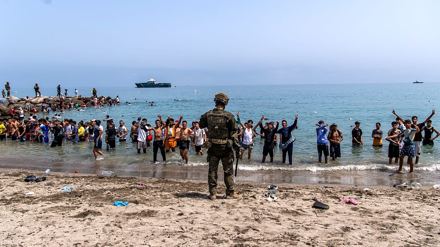 Spanish army soldiers block access to the beach for people crossing from Morocco into the Spanish enclave of Ceuta on Friday, 31 July 2026.